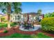 Outdoor living is made easy with a patio, outdoor dining and beautiful yard views at 1187 Out Of Bounds Dr, Summerville, SC 29485