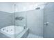 This bathroom showcases a modern walk-in shower and a soaking tub at 1187 Out Of Bounds Dr, Summerville, SC 29485