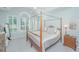 Serene bedroom features a four-poster bed, plantation shutters, and elegant decor, creating a relaxing retreat at 1187 Out Of Bounds Dr, Summerville, SC 29485