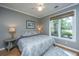 Comfortable bedroom features a ceiling fan, a window and a gray color scheme at 1187 Out Of Bounds Dr, Summerville, SC 29485