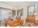 Formal dining room with wood table, chandelier, and detailed trim at 1187 Out Of Bounds Dr, Summerville, SC 29485