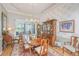 Formal dining room with wood table, chandelier, and large window at 1187 Out Of Bounds Dr, Summerville, SC 29485