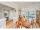 Elegant dining room with chandelier, wood floors, and lots of light at 1187 Out Of Bounds Dr, Summerville, SC 29485