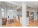 Spacious foyer with hardwood floors, white columns, and view of the dining room at 1187 Out Of Bounds Dr, Summerville, SC 29485