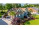 Charming brick home with blue shutters, complemented by meticulously landscaped grounds and a welcoming walkway at 1187 Out Of Bounds Dr, Summerville, SC 29485