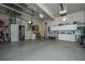 Spacious garage with ample storage and workspace, plus side door access at 1187 Out Of Bounds Dr, Summerville, SC 29485