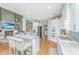 Open-concept kitchen features granite counters, stainless appliances, and a seamless flow into the living area at 1187 Out Of Bounds Dr, Summerville, SC 29485