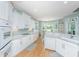 Well-appointed kitchen with white cabinetry, subway tile backsplash, stainless steel appliances, and breakfast nook at 1187 Out Of Bounds Dr, Summerville, SC 29485