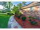 Stone walkway bordered by colorful rose bushes and green shrubbery, enhanced by mulch at 1187 Out Of Bounds Dr, Summerville, SC 29485