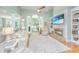 Bright living room with fireplace, built-in shelves, and open floor plan at 1187 Out Of Bounds Dr, Summerville, SC 29485