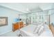 This bedroom boasts a four-poster bed, cool color palette, and tray ceiling at 1187 Out Of Bounds Dr, Summerville, SC 29485