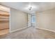 Carpeted bedroom featuring a ceiling fan, neutral walls, and walk-in closet for ample storage space at 1210 Azalea Dr, Summerville, SC 29483