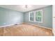 Bedroom featuring two windows for natural light, carpet flooring, and a ceiling fan at 1210 Azalea Dr, Summerville, SC 29483