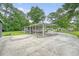 Large driveway with car port, leading to a screened-in back porch at 1210 Azalea Dr, Summerville, SC 29483