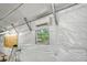 View of garage with window, AC, ladder, tools and white plastic sheeting on ceiling and walls at 1210 Azalea Dr, Summerville, SC 29483