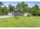 Large backyard garage providing ample storage space at 1210 Azalea Dr, Summerville, SC 29483