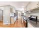 Well-lit kitchen featuring stainless steel appliances, ample cabinet space, and durable countertops at 1210 Azalea Dr, Summerville, SC 29483