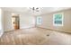 Spacious living room featuring neutral walls, plush carpet, and a ceiling fan for comfort at 1210 Azalea Dr, Summerville, SC 29483