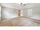 Open living space with neutral walls, carpet flooring, a ceiling fan and views of the entryway at 1210 Azalea Dr, Summerville, SC 29483