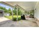 Spacious covered patio with concrete flooring, offering an outdoor living area and shed in backyard at 1210 Azalea Dr, Summerville, SC 29483