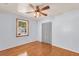 Bedroom has wood floors, a ceiling fan, a window, and a closet for storage at 1222 Maxwell St, North Charleston, SC 29405