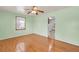 Bright bedroom with hardwood floors, a ceiling fan, and ample natural light at 1222 Maxwell St, North Charleston, SC 29405