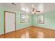 Inviting bedroom featuring hardwood floors, two windows, and fresh paint at 1222 Maxwell St, North Charleston, SC 29405