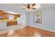 Dining room has wood floors, a window, and a ceiling fan and is open to the kitchen at 1222 Maxwell St, North Charleston, SC 29405