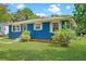 Charming single-story home with a blue exterior, white trim, and a well-maintained front lawn at 1222 Maxwell St, North Charleston, SC 29405