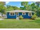 Charming single-story home with a blue exterior, well-manicured lawn, and inviting entrance at 1222 Maxwell St, North Charleston, SC 29405