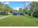 Charming blue home with a well-manicured lawn, long driveway, and lovely shade trees at 1222 Maxwell St, North Charleston, SC 29405