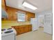 Functional kitchen with classic wood cabinets and white appliances at 1222 Maxwell St, North Charleston, SC 29405