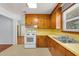 Charming kitchen features original wood cabinets and a bright, functional layout at 1222 Maxwell St, North Charleston, SC 29405