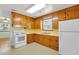 Efficient kitchen featuring classic wood cabinets, and white appliances at 1222 Maxwell St, North Charleston, SC 29405