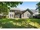 Large backyard featuring a screened-in porch, a patio and mature trees at 1223 Creek Stone Way, Hanahan, SC 29410