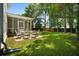 Spacious backyard with a patio, outdoor seating, and lush landscaping at 1223 Creek Stone Way, Hanahan, SC 29410
