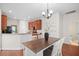 Cozy dining area featuring wood floors, a modern chandelier, and an open floorplan at 1223 Creek Stone Way, Hanahan, SC 29410