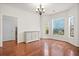 Bright dining room with hardwood floors, natural light, and stylish cabinet at 1223 Creek Stone Way, Hanahan, SC 29410