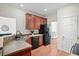 Functional kitchen features wood floors, a double sink, and black appliances at 1223 Creek Stone Way, Hanahan, SC 29410