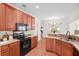 Stylish kitchen boasts modern appliances, wood floors, and plenty of counter space at 1223 Creek Stone Way, Hanahan, SC 29410