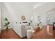 Bright, open living room with soaring ceilings, hardwood floors, and neutral decor at 1223 Creek Stone Way, Hanahan, SC 29410