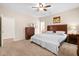 Spacious main bedroom featuring a ceiling fan, dresser, and carpeted floor at 1223 Creek Stone Way, Hanahan, SC 29410