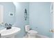 Charming powder room featuring a pedestal sink and toilet at 1223 Creek Stone Way, Hanahan, SC 29410