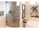 Modern bathroom with a glass-enclosed shower featuring decorative tile work and a soaking tub at 126-C Jungle Rd, Edisto Beach, SC 29438