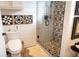 Contemporary bathroom featuring decorative wall accents, a walk-in shower, and a plush rug at 126-C Jungle Rd, Edisto Beach, SC 29438
