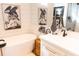 Modern bathroom featuring a soaking tub, white vanity, and stylish decor at 126-C Jungle Rd, Edisto Beach, SC 29438