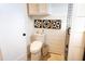 Clean bathroom design, featuring a toilet and decorative tile accents in walk-in shower at 126-C Jungle Rd, Edisto Beach, SC 29438