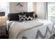 Comfortable bedroom with a bed featuring stylish linens and neutral tones, bright natural lighting at 126-C Jungle Rd, Edisto Beach, SC 29438