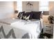 Comfortable bedroom with a bed featuring stylish linens and neutral tones, bright natural lighting at 126-C Jungle Rd, Edisto Beach, SC 29438