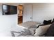 Stylish bedroom featuring shiplap walls and partial view of the kitchen through an open door at 126-C Jungle Rd, Edisto Beach, SC 29438